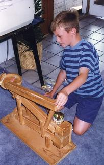 Andrew experimenting with a marble machine